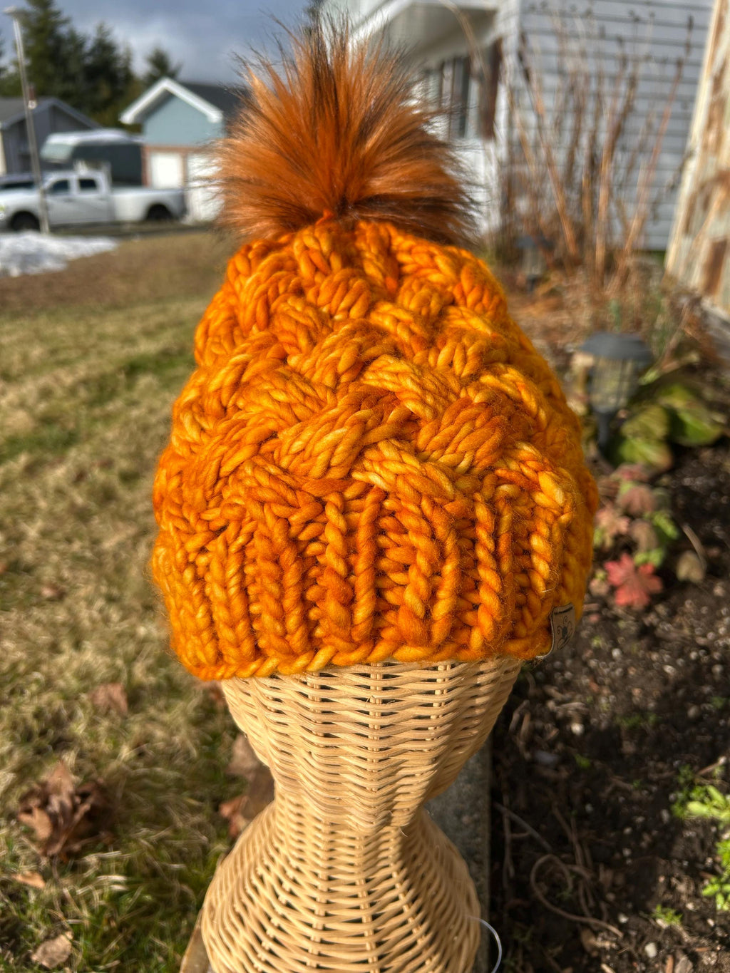 Handmade Merino Wool Knit Beanie: orange colour cable knit with Faux Fur Pompom