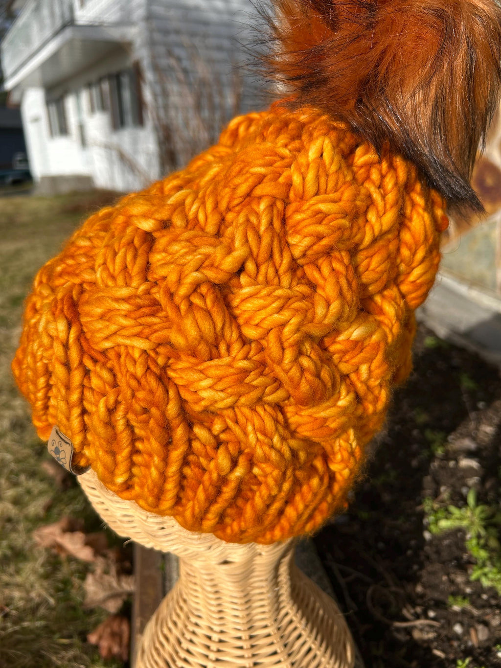 Handmade Merino Wool Knit Beanie: orange colour cable knit with Faux Fur Pompom