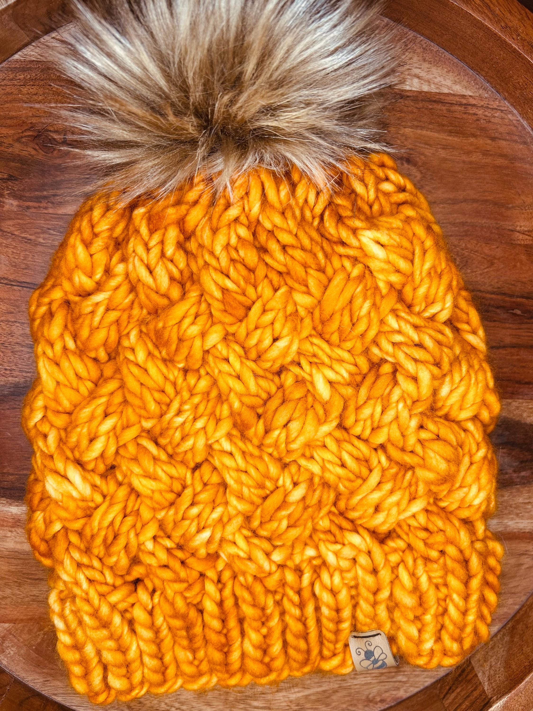 Handmade Merino Wool Knit Beanie: orange colour cable knit with Faux Fur Pompom