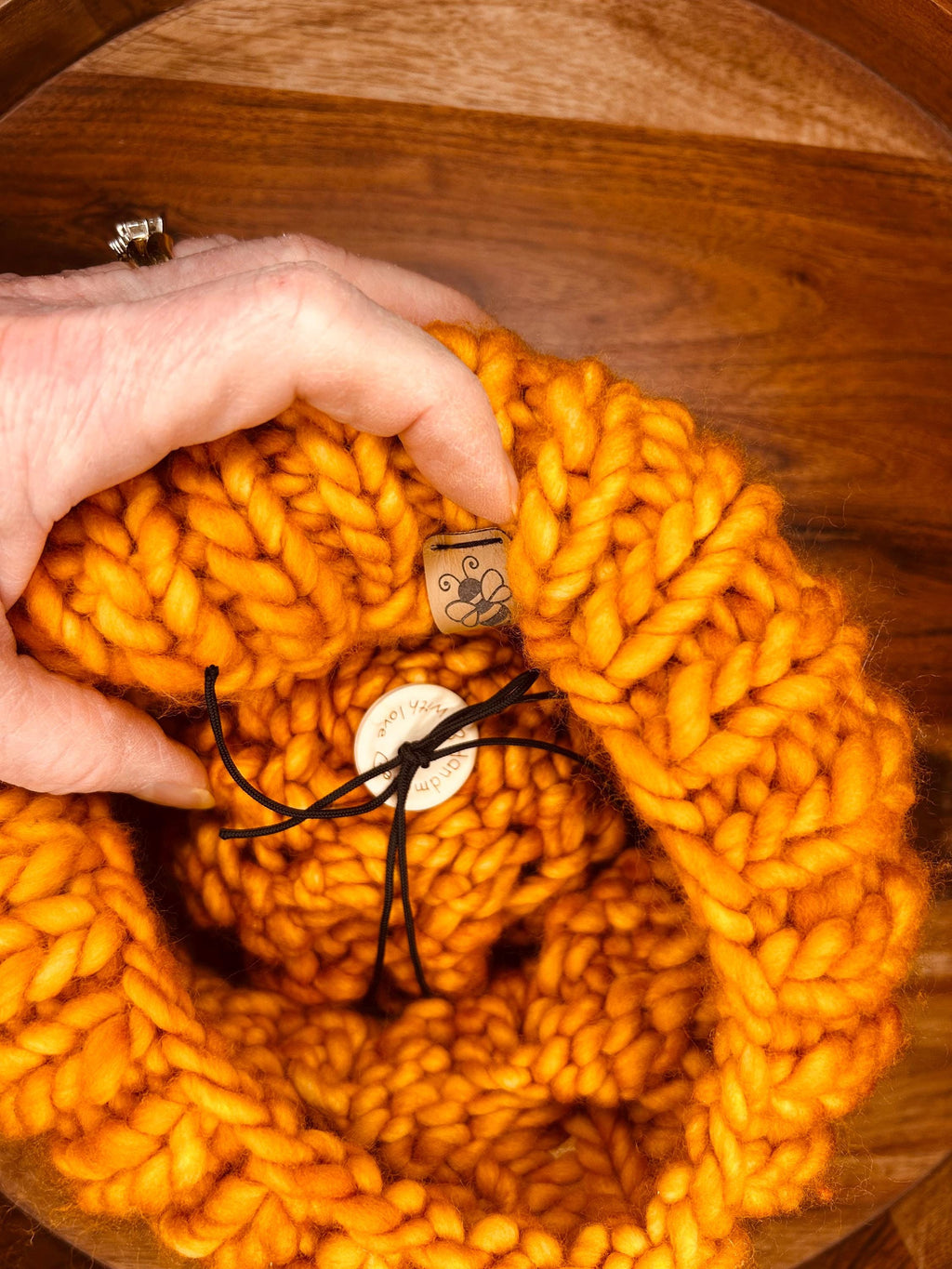 Handmade Merino Wool Knit Beanie: orange colour cable knit with Faux Fur Pompom