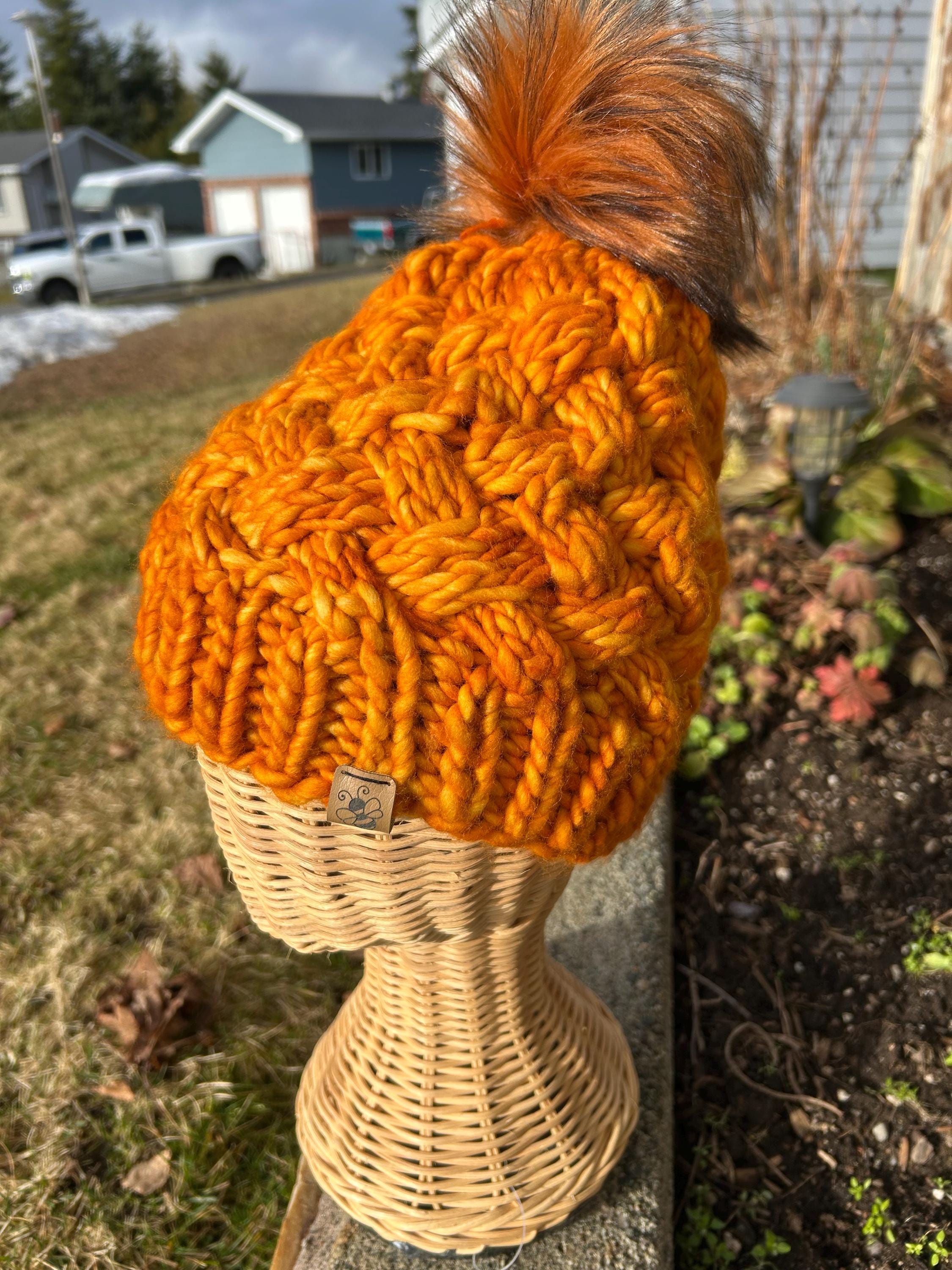 Handmade Merino Wool Knit Beanie: orange colour cable knit with Faux Fur Pompom
