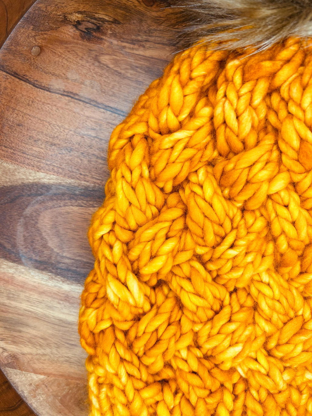 Handmade Merino Wool Knit Beanie: orange colour cable knit with Faux Fur Pompom