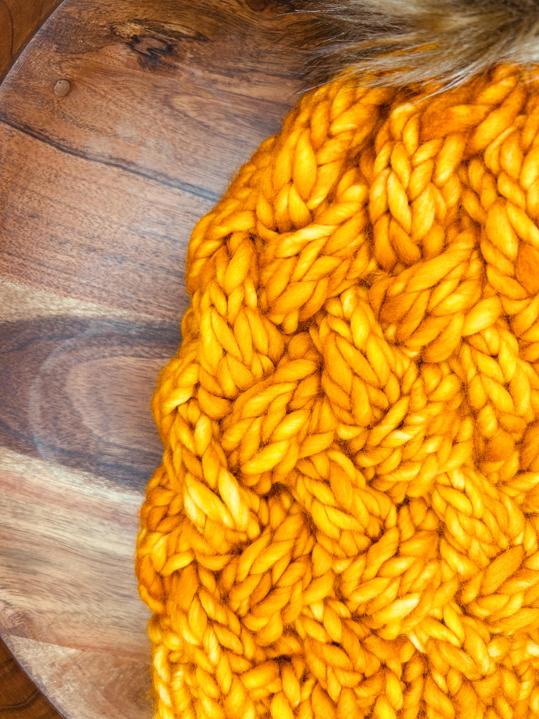 Handmade Merino Wool Knit Beanie: orange colour cable knit with Faux Fur Pompom