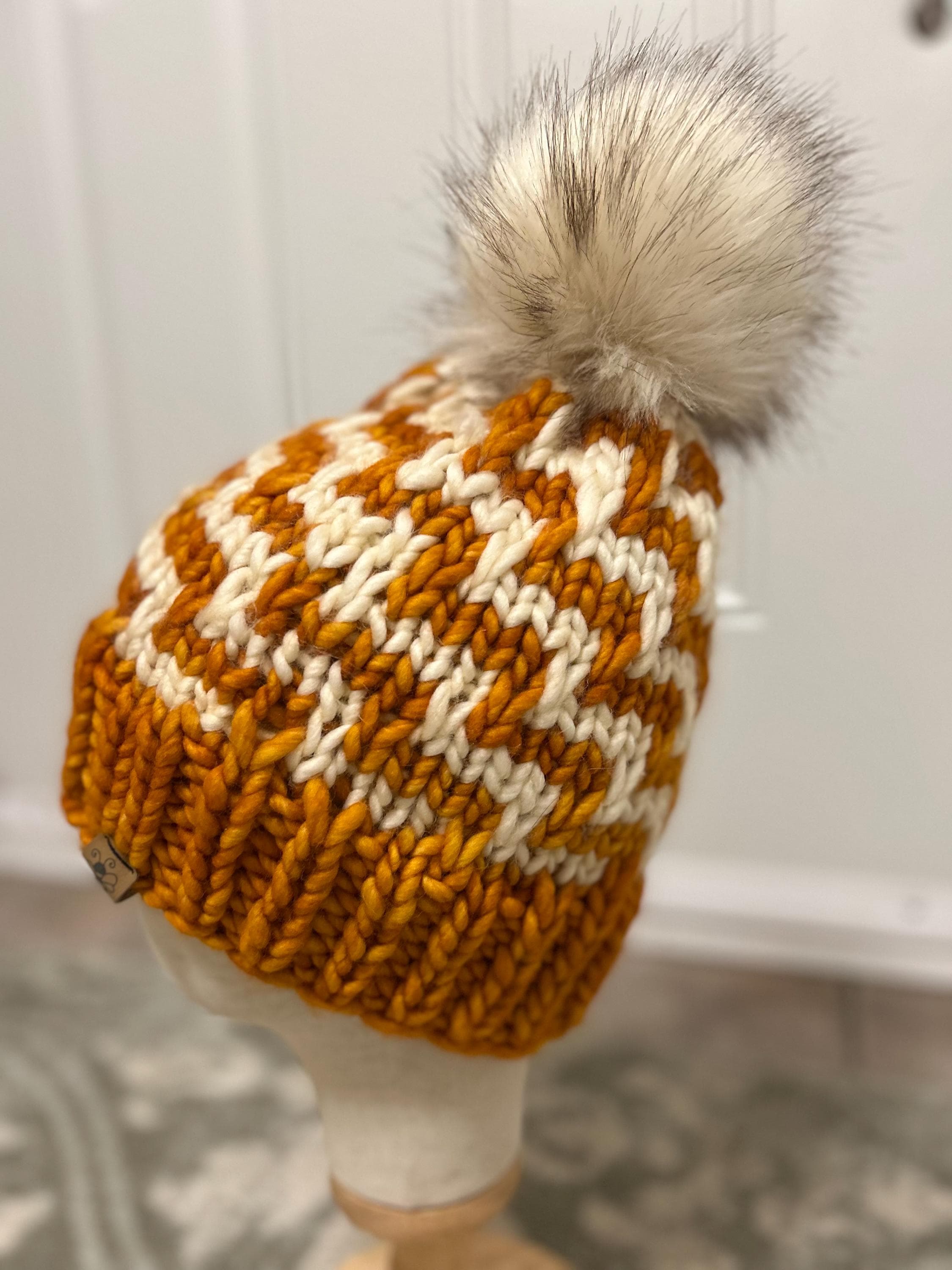 Handmade Merino Wool Knit Beanie: orange colour cable knit with Faux Fur Pompom